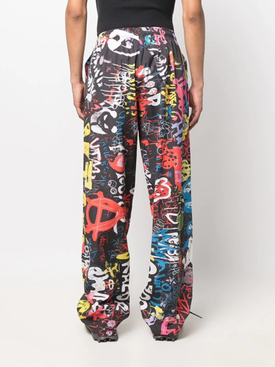 Shop Vetements Graffiti-print Trousers In Black