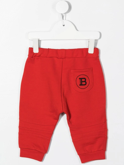Shop Balmain Logo-print Cotton Track Pants In Red