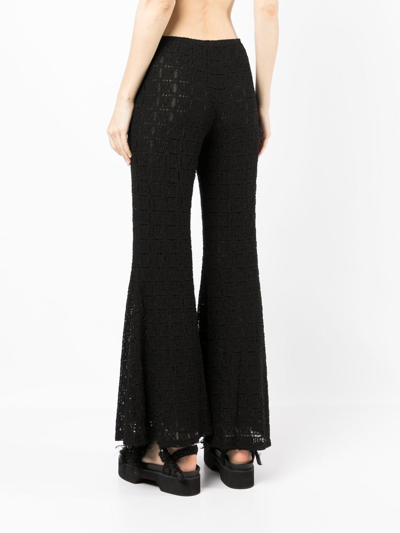 Shop Anna Sui Flared Crochet-knit Trousers In Black