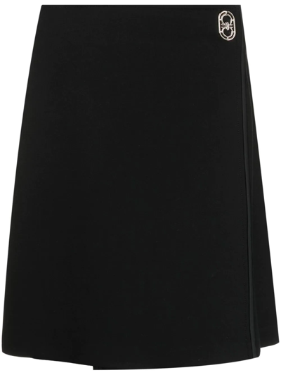 Shop Ferragamo Logo-plaque Wrap Mini Skirt In Black