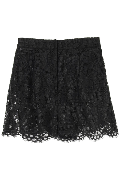 Shop Dolce & Gabbana Laminated Lace Shorts In Black