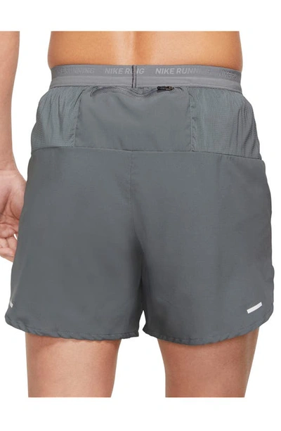 Shop Nike Dri-fit Stride 5-inch Running Shorts In Grey/ Black/ Reflective Silver