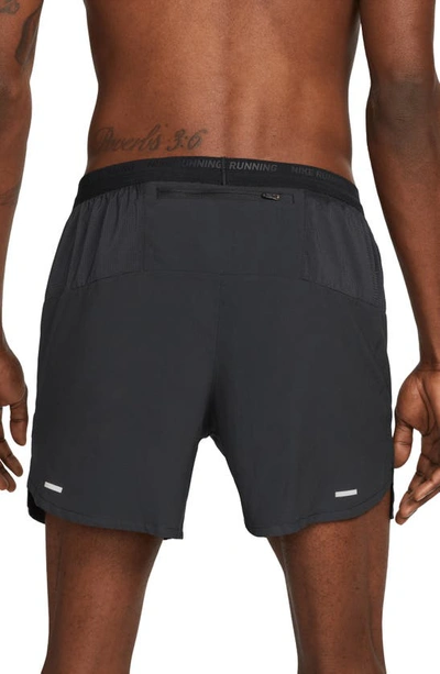 Shop Nike Dri-fit Stride 5-inch Running Shorts In Black/ Black