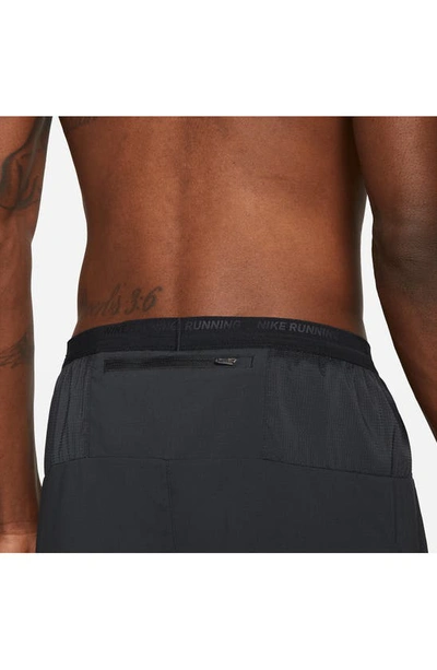 Shop Nike Dri-fit Stride 5-inch Running Shorts In Black/ Black