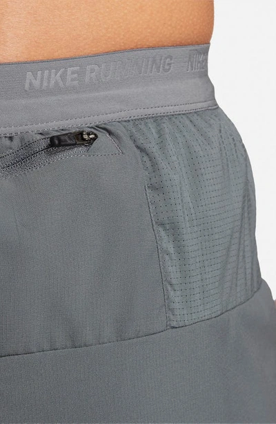 Shop Nike Dri-fit Stride 5-inch Running Shorts In Grey/ Black/ Reflective Silver
