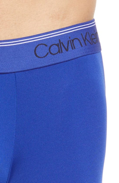 Shop Calvin Klein 3-pack Low Rise Microfiber Stretch Boxer Briefs In Orange/ Blue/ Olive