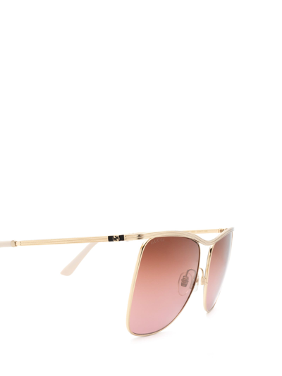 Shop Gucci Gg0820s Gold Sunglasses