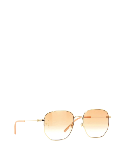 Shop Gucci Gg0396s Gold Sunglasses