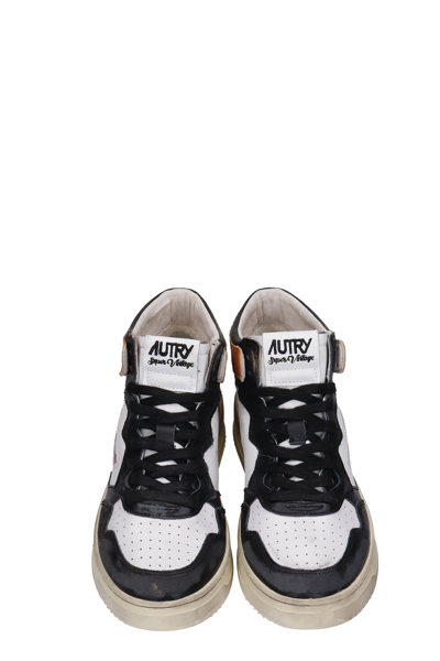 Shop Autry Sup Vintage Sneakers In White Leather In Bianco/marrone
