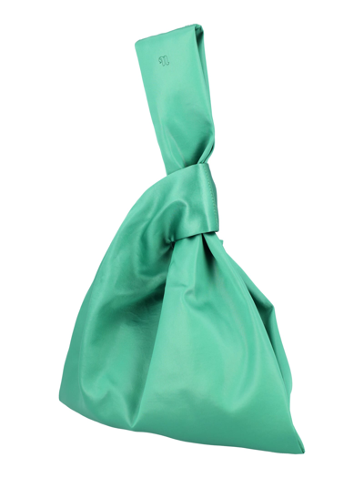 Shop Nanushka Jen Satin Wristlet Bag In Green