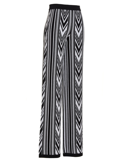 Shop Balmain Chevron Pattern Trousers In White/black