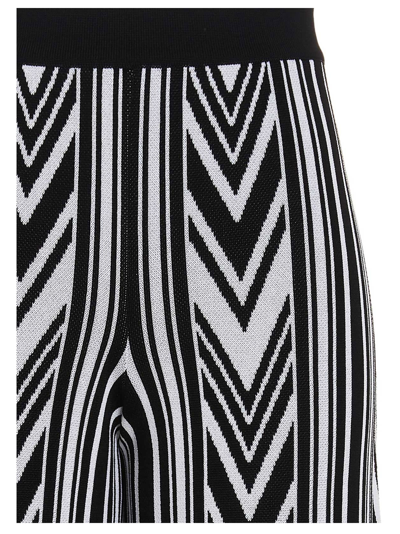 Shop Balmain Chevron Pattern Trousers In White/black