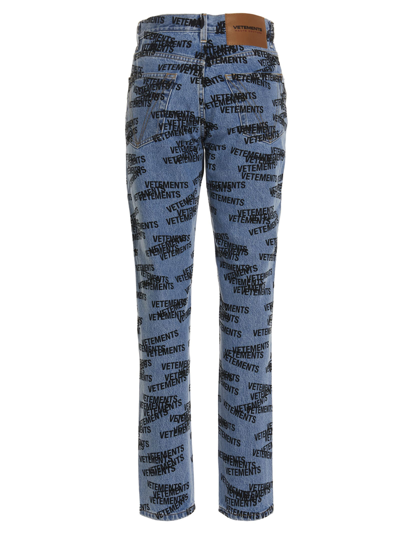 Shop Vetements Logo Print Jeans In Light Blue