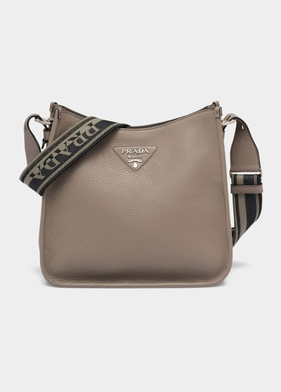 Shop Prada Logo Pebbled Leather Hobo Bag In F0572 Argilla