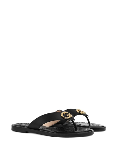 Shop Gucci Interlocking G Thong-strap Slides In Schwarz