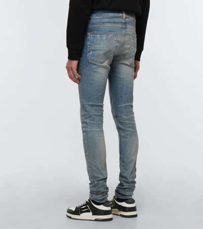 Shop Amiri Stack Low-rise Skinny Jeans In Clay Indigo