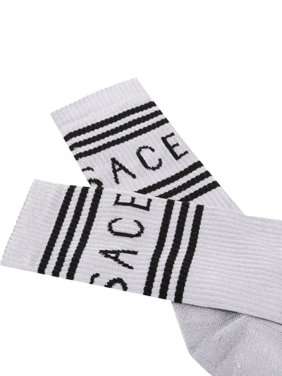 Shop Versace Logo-print Striped Socks In Silver