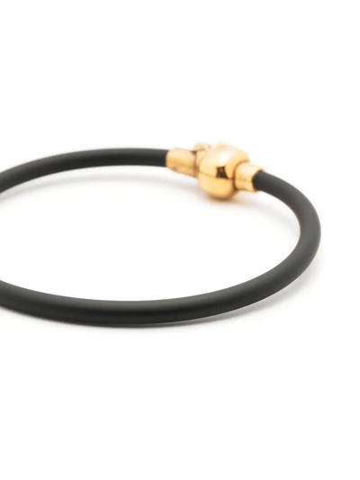 Alexander Mcqueen Skull-charm Slip-on Bracelet In Black