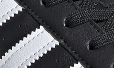 Shop Adidas Originals Superstar Sneaker In Black/ White/ Gold Metallic