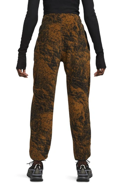 Shop Nike Acg Therma-fit Wolf Tree Print Pants In Hazel Rush/ Black/ White