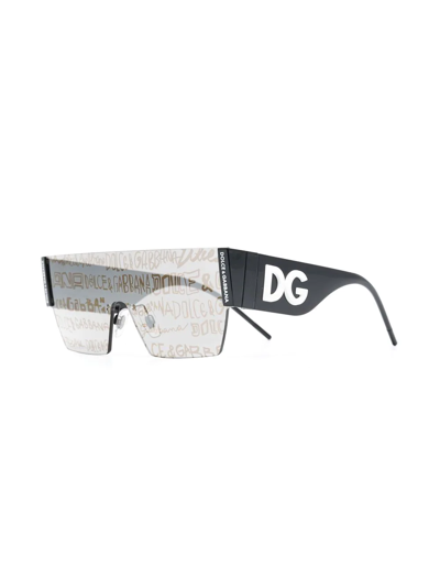 Shop Dolce & Gabbana Shield-frame Lens-decal Sunglasses In Schwarz