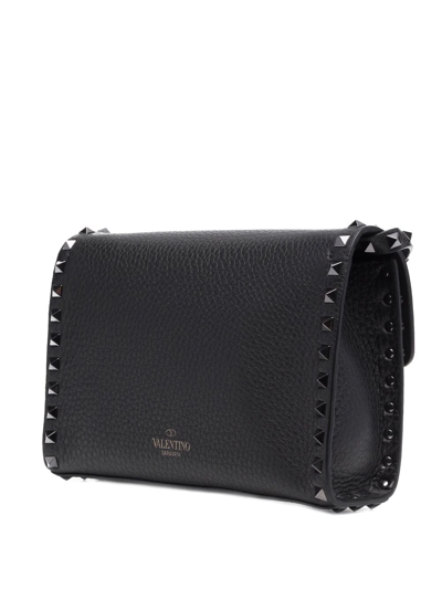 Shop Valentino Small Rockstud Leather Crossbody Bag In Black