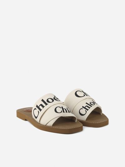 Shop Chloé Woody Sandals In Canvas With Contrasting Logo Print