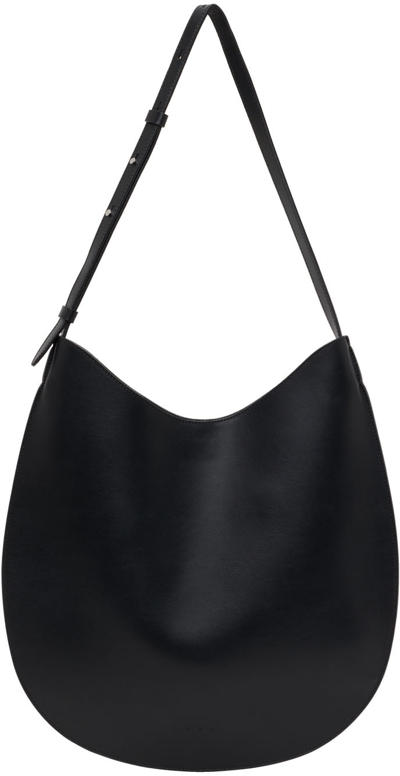 Shop Aesther Ekme Black Leather Flat Shoulder Bag In 101 Black