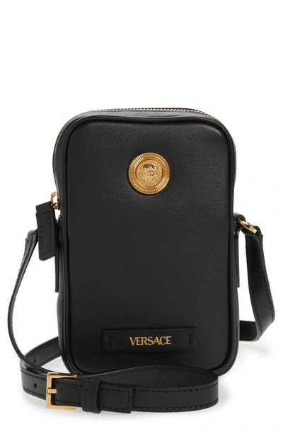 Shop Versace Biggie Medusa Coin Phone Crossbody Bag In Black/  Gold