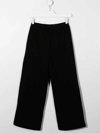 Shop Balmain Stud-embellished Logo-detail Trousers In Black