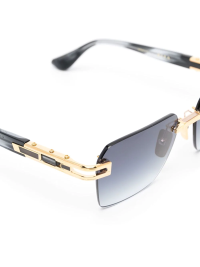 Shop Dita Eyewear Frameless Titanium Sunglasses In Gold
