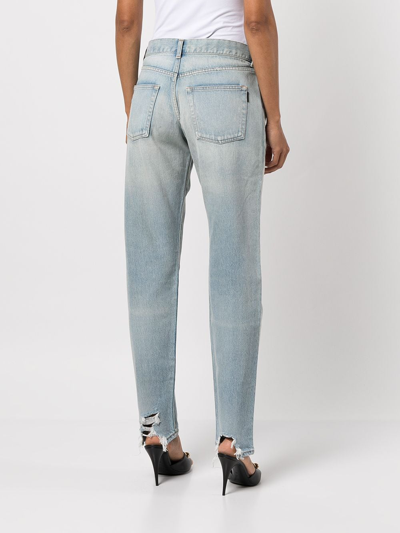 Shop Saint Laurent Low-rise Distressed Boyfriend Jeans In Blue