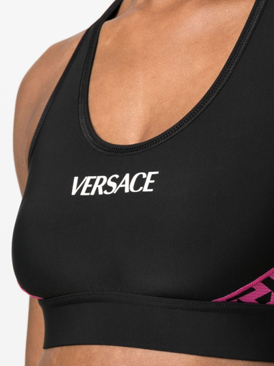 VERSACE Printed stretch sports bra