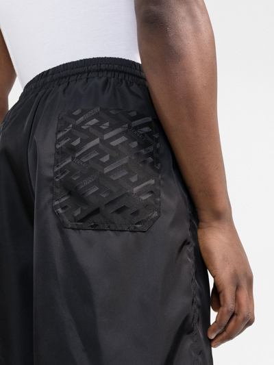 Shop Versace La Greca Straight-leg Bermuda Shorts In Black