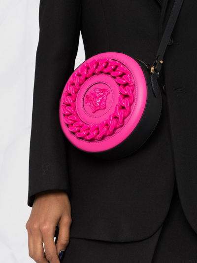 Shop Versace La Medusa Round Crossbody Bag In Pink