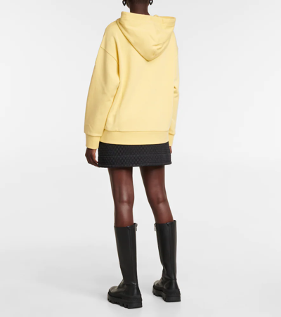 Shop Moncler Logo Cotton Jersey Hoodie In Yellow