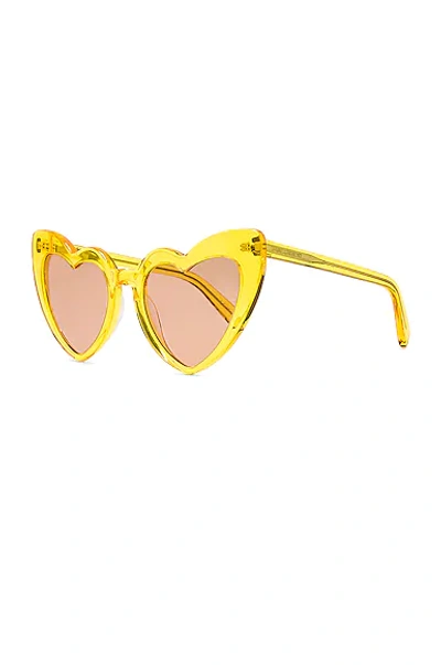 Shop Saint Laurent Heart Sunglasses In Yellow