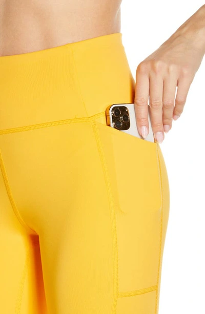 Shop Girlfriend Collective High Waist Pocket Leggings In Golden Glow