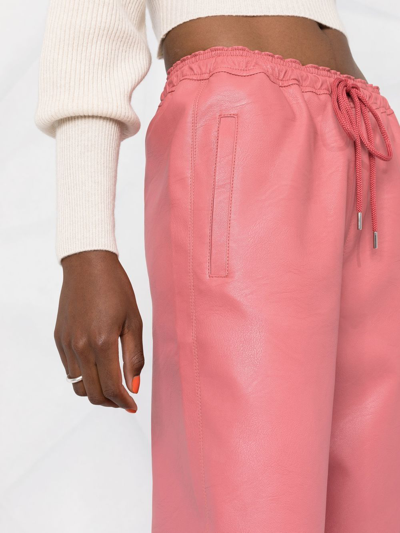 Shop Stella Mccartney Faux-leather Tapered Trousers In Pink