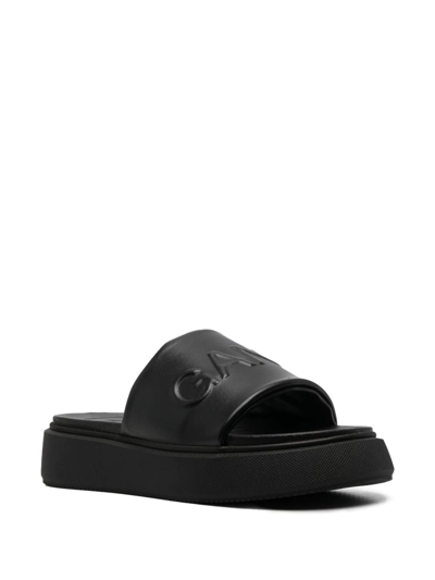 Shop Ganni Logo-embossed Slide Sandals In Schwarz