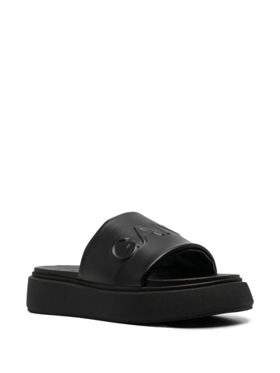 Ganni Logo-embossed Vegan Leather Platform Slides In Schwarz