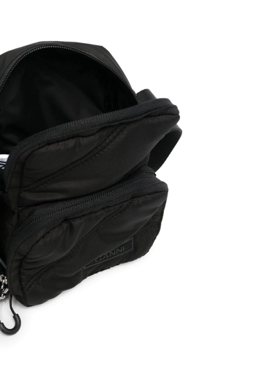 Shop Ganni Quilted Tech Crossbody Bag In Schwarz
