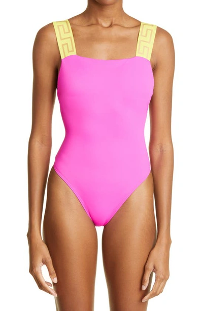 Shop Versace Greca Strap One-piece Swimsuit In Fuchsia Yellow