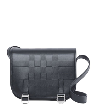 Shop Burberry Embossed Check Messenger Bag In Black