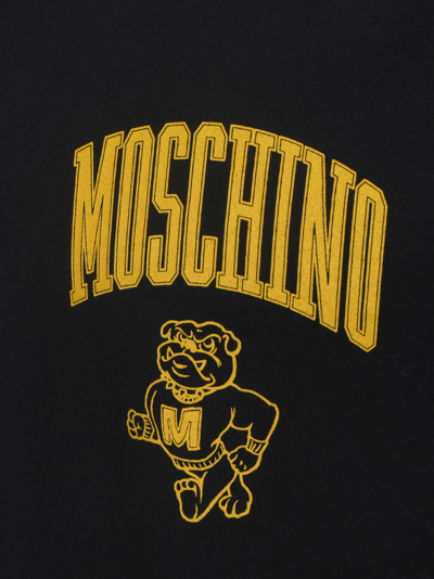 Shop Moschino T-shirt In Black/yellow