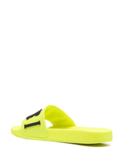 Amiri Logo-embossed Rubber Slides In Yellow