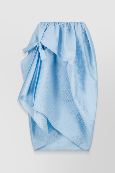 Shop Cecilie Bahnsen Matelassé Voluminous Asymmetrical Skirt With Bow Detail In Blue