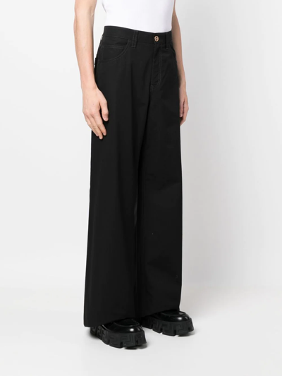 Shop Versace Wide-leg Trousers In Black
