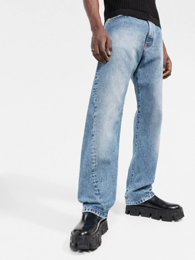 Shop Versace Twisted Seam Denim Jeans In Blue