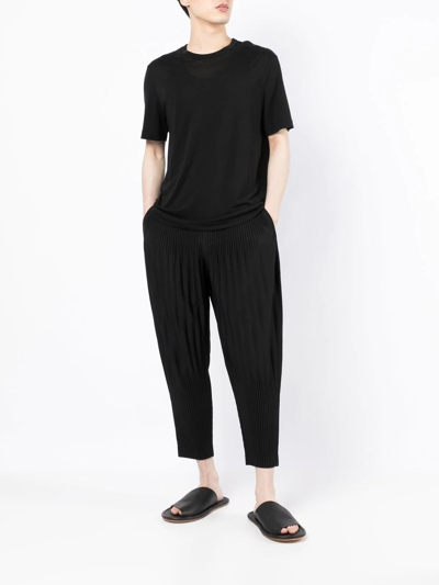 Shop Issey Miyake Pleat-detail Cropped Trousers In Black